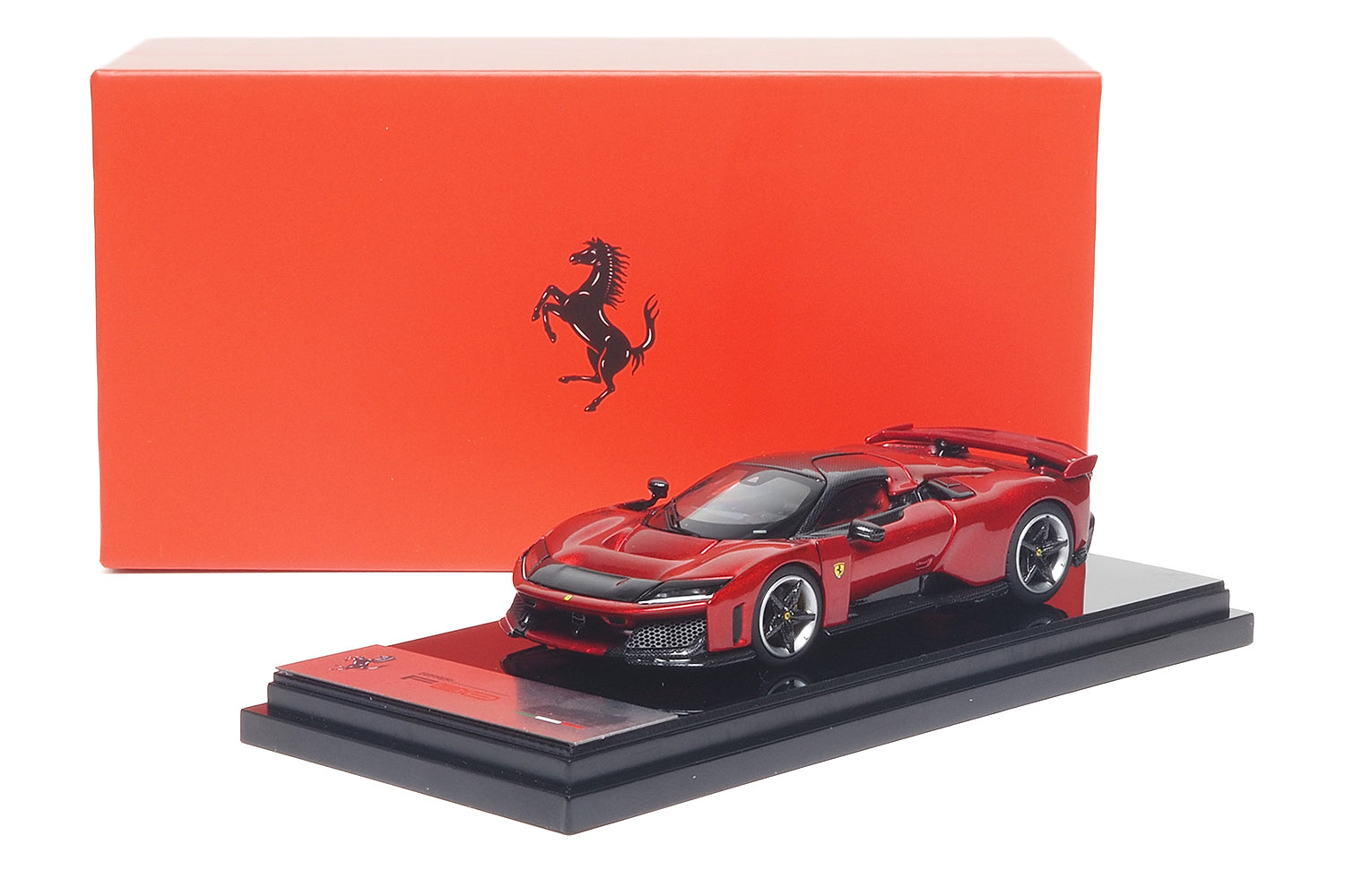 BBR 1/64 Ferrari F80 Rosso Supercar model on a black display base with a red box behind it